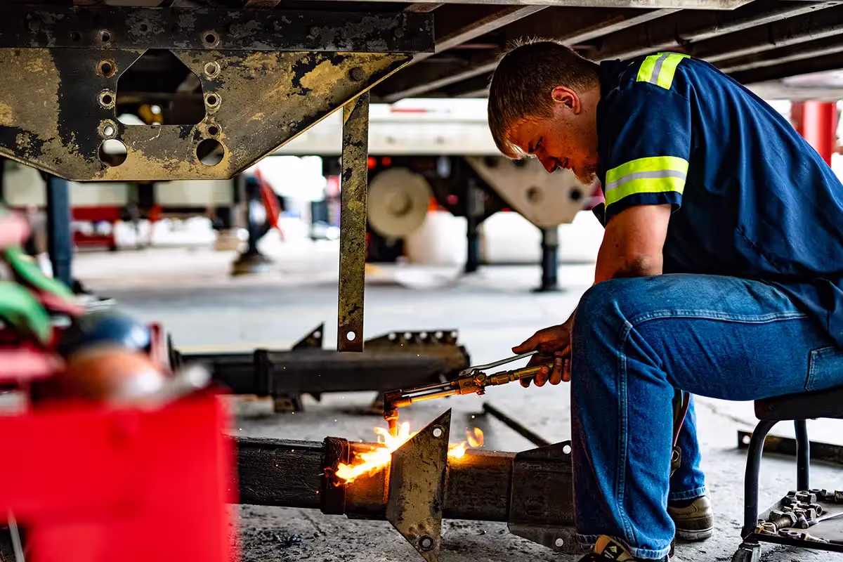 Mechanic performing custom truck modifications
